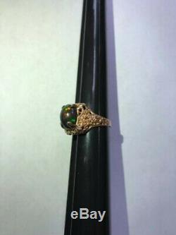 3.85 ct Natural black opal, 10 k rose gold unisex art deco style ring. See Video