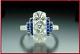 Art Deco Style Simulated Diamond And Blue Sapphire Engagement Ring In 925 Silver