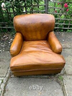 Beautiful vintage art deco leather arm chair with footstool. Howard & Son style