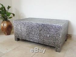 Black and silver embossed coffee table with drawers