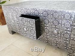 Black and silver embossed coffee table with drawers