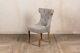 French Style Upholstered Dining Chair In Stone With Button Back And Ring Detail