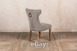 French Style Upholstered Dining Chair In Stone With Button Back And Ring Detail