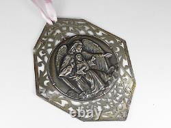 Collier pendentif 'Que Dieu vous bénisse' en argent sterling, signé dans le style Art déco.