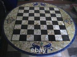 Table de réunion ronde avec plateau en marbre incrusté de motifs d'échecs de 48 pouces.