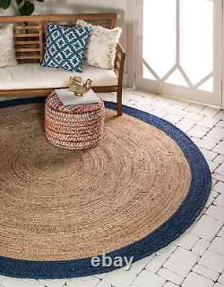 Tapis rond en jute 100% naturel avec ligne bleue tressée, aspect rustique réversible.