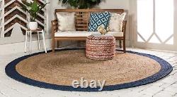 Tapis rond en jute 100% naturel avec ligne bleue tressée, aspect rustique réversible.